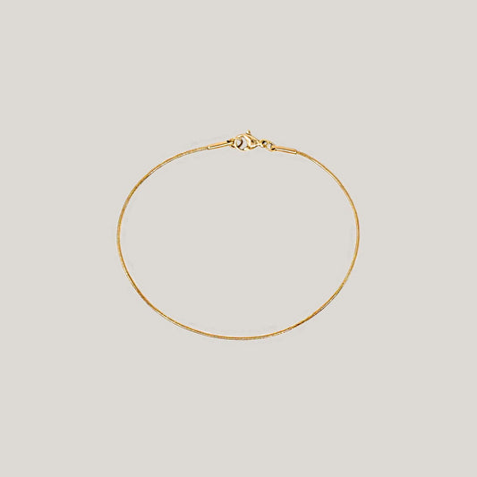 Thin round snake chain bracelet gold